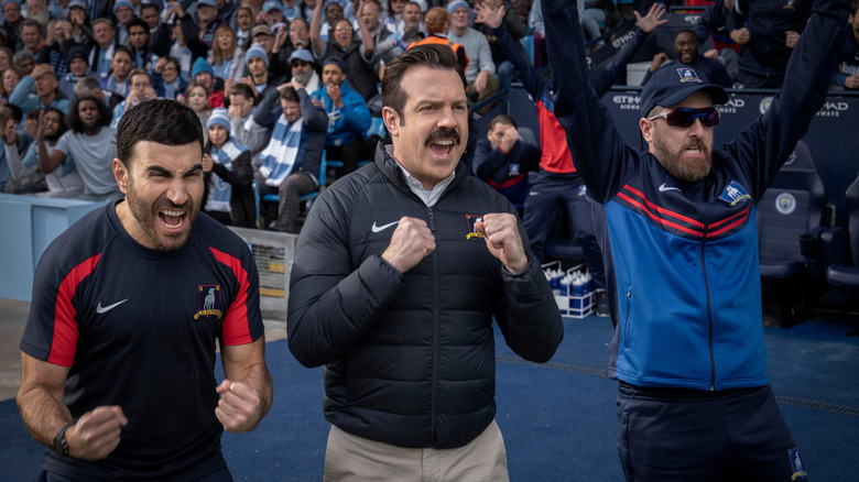 Roy, Ted, and Beard cheering