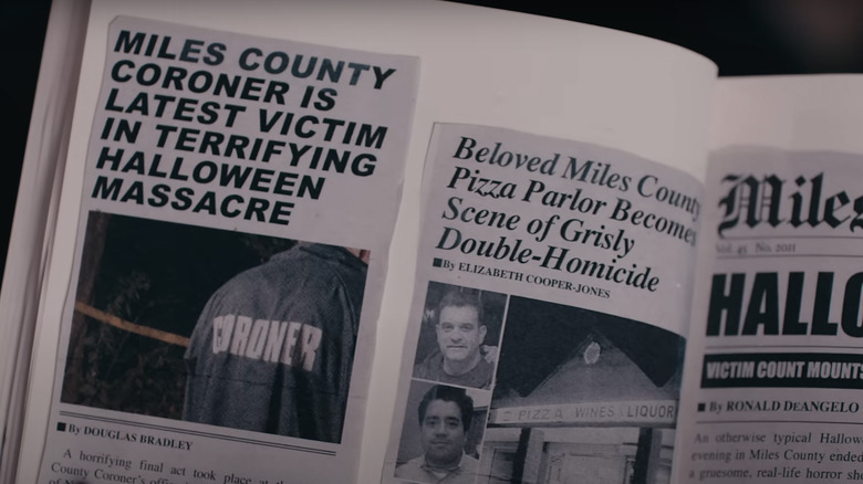 A scrapbook contains newspaper clippings with the headlines "Miles County Coroner is Latest Victim in Terrifying Halloween Massacre" and "Beloved Miles County Pizza Parlor Becomes Scene of Grisly Double-Homicide"