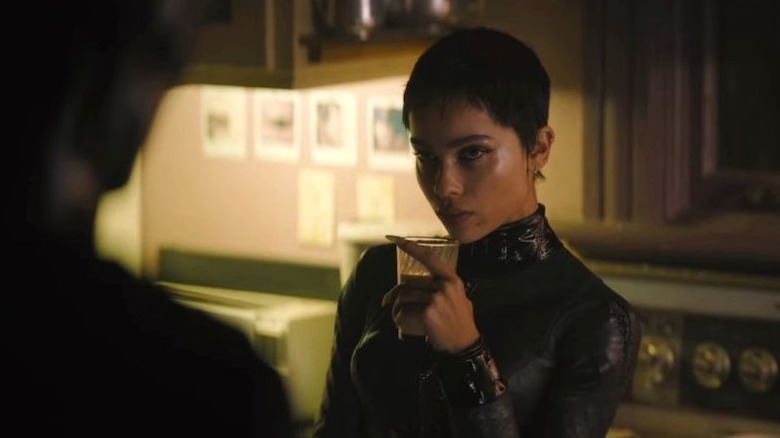 Selina Kyle with a glass of milk