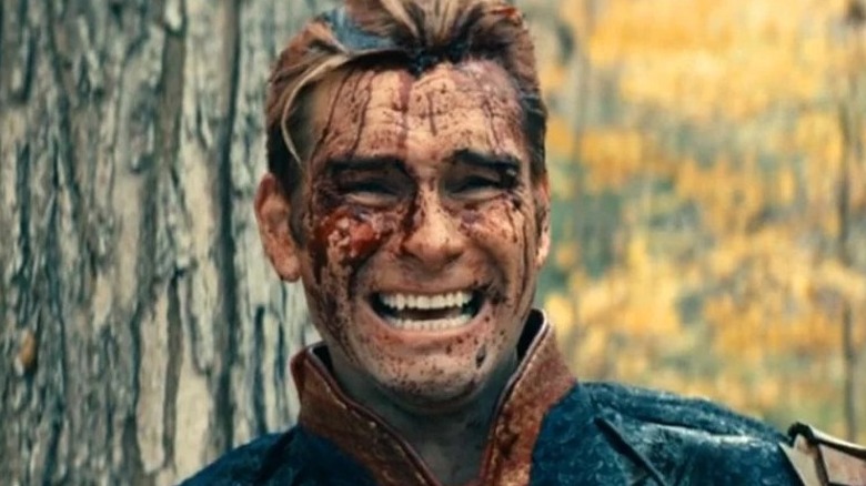 A bloodied Homelander grimaces