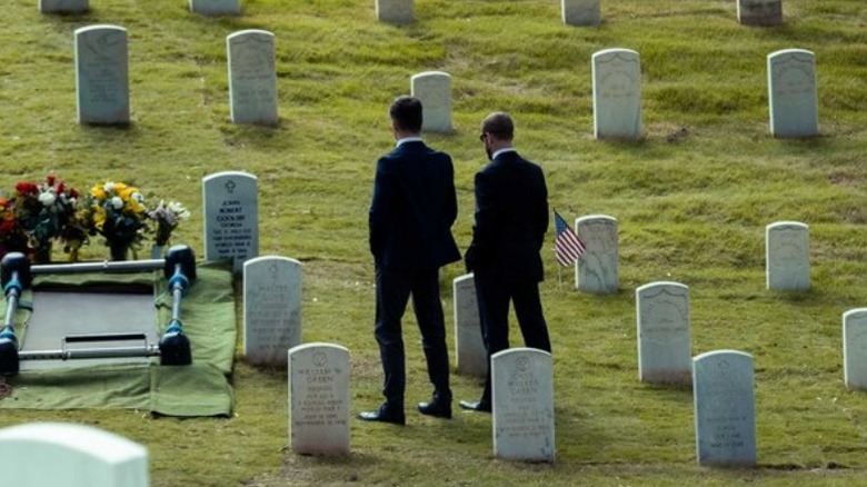 James and Mike stand by grave The Contractor