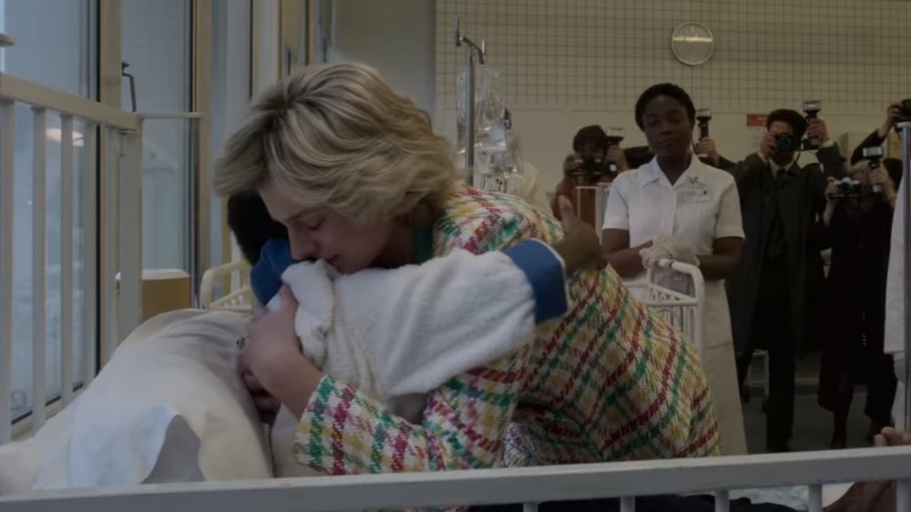 Princess Diana hugging a young person living with HIV/AIDS on The Crown