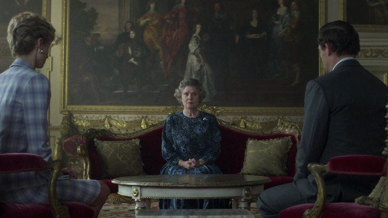 Queen Elizabeth sitting opposite Charles and Diana