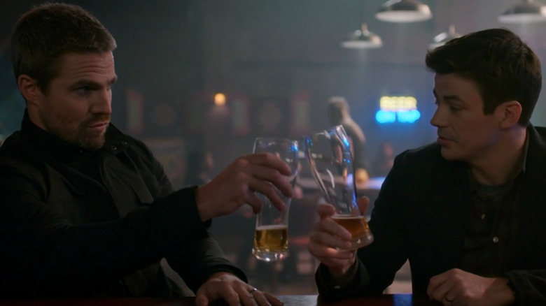 Oliver Queen and Barry Allen toast