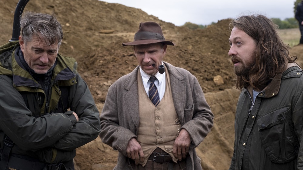 Director Simon Stone with Ralph Fiennes on The Dig set