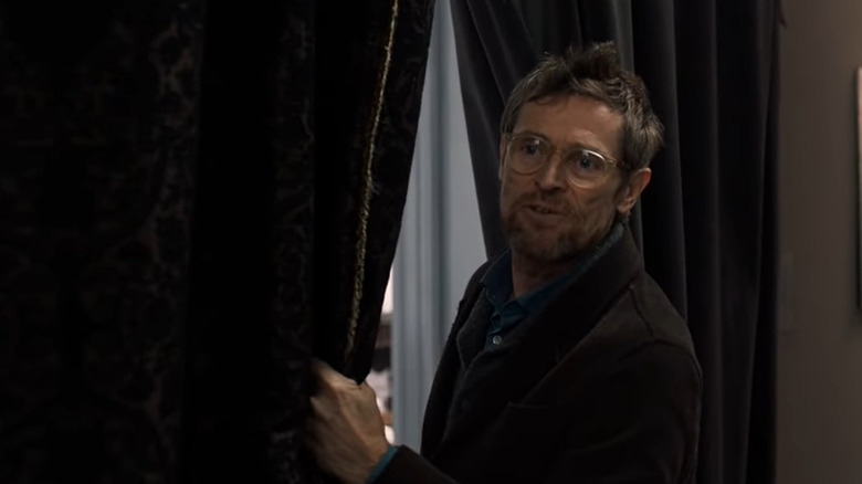 Willem Dafoe smiling with curtain The Fault in Our Stars