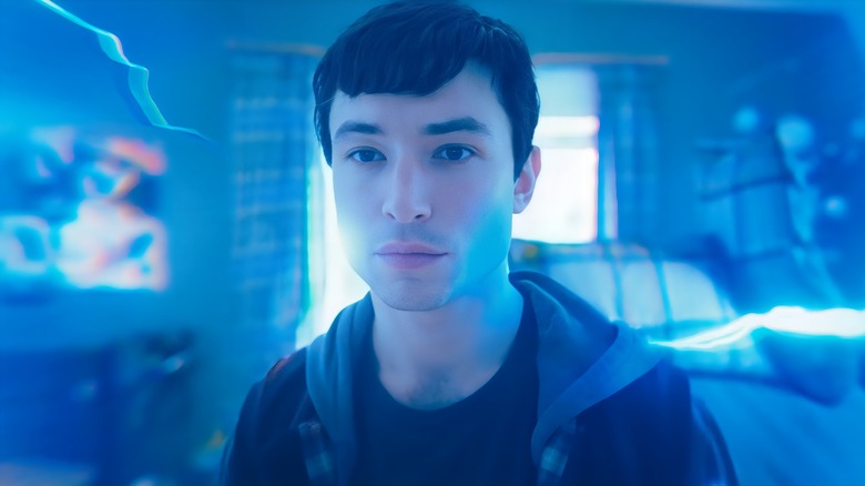 Barry Allen in his room in blue light