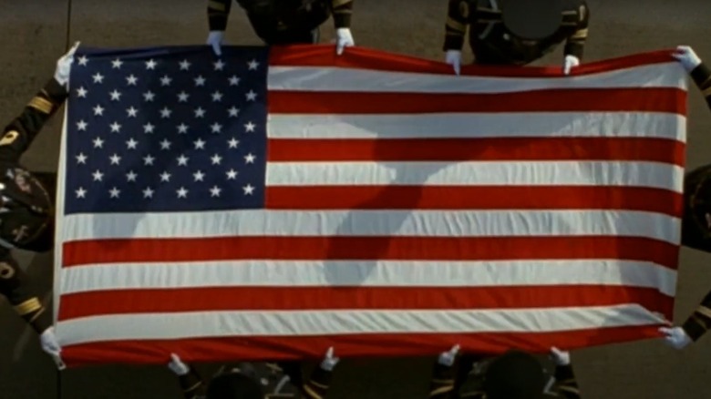 Soldiers placing an American flag over a casket in The General's Daughter