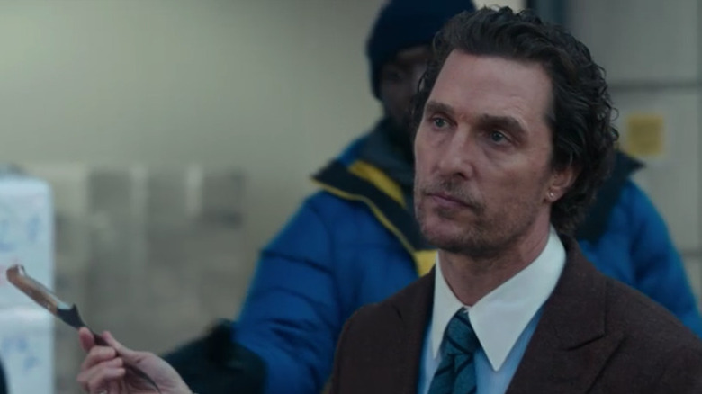 Matthew McConaughey holding a knife