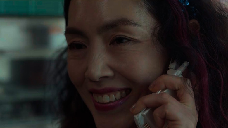 Dong-Eun's mother smiles on the phone