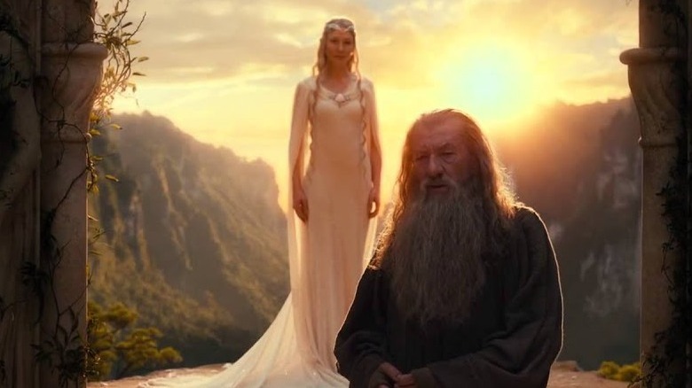 Galadriel stands behind Gandalf