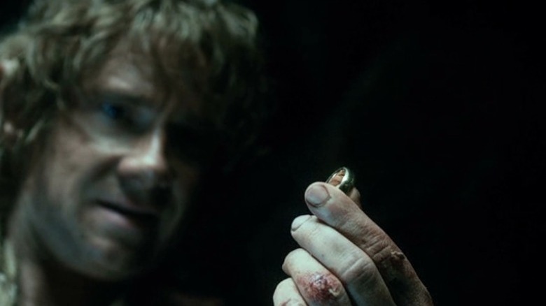 Bilbo holds the ring