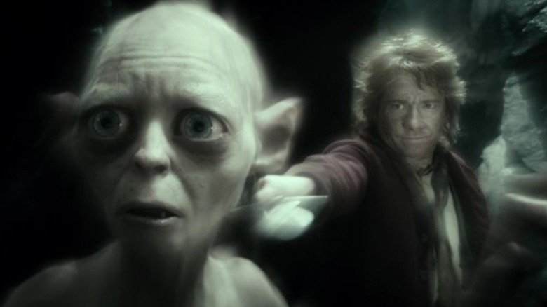 Bilbo holds sword to Gollum's neck