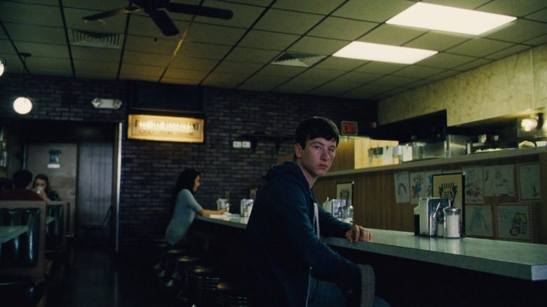 Martin sits quietly at a diner counter