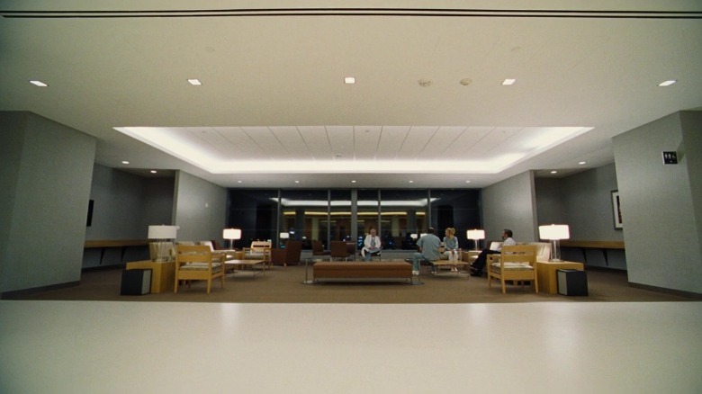 Steven, Anna, and other doctors sitting in a hospital lobby