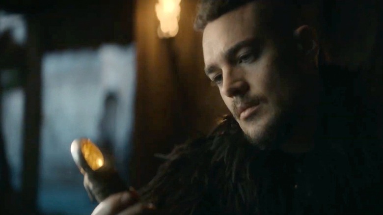 Uhtred looks at his sword