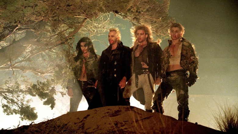 The Lost Boys standing on a hill