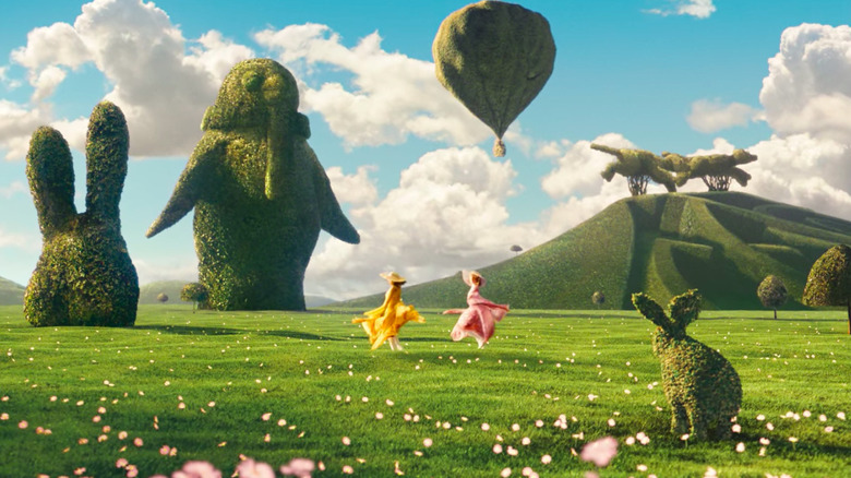 Girls twirling in surreal green field in "The Lovely Bones"