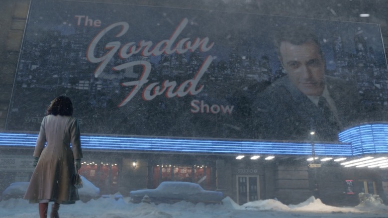 Midge looks at Gordon Ford Show billboard