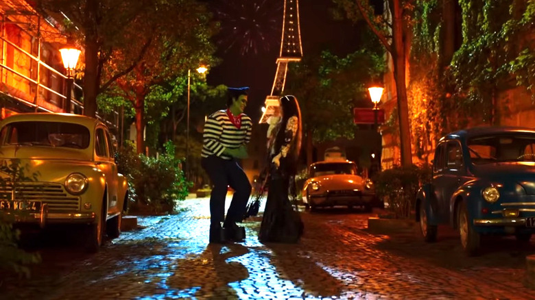 Herman and Lily Munster dance on a Paris street