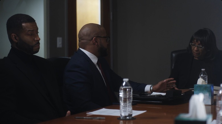 Maurice and lawyer talking with mediator