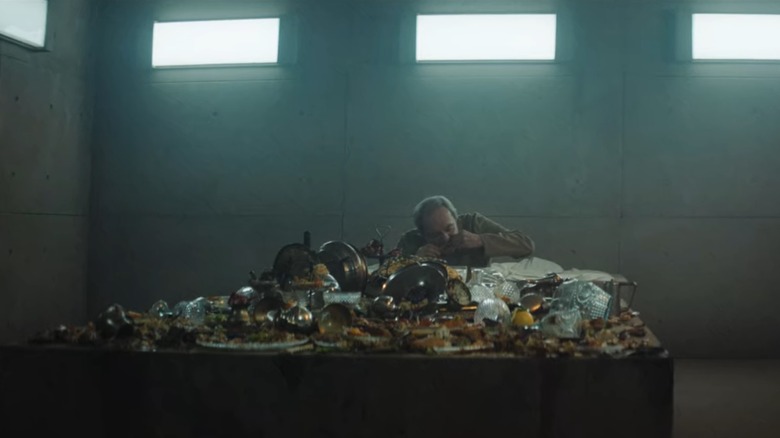 A man sits at a feast