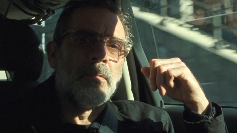 Jacob riding in the back of car in The Postcard Killings (2022)