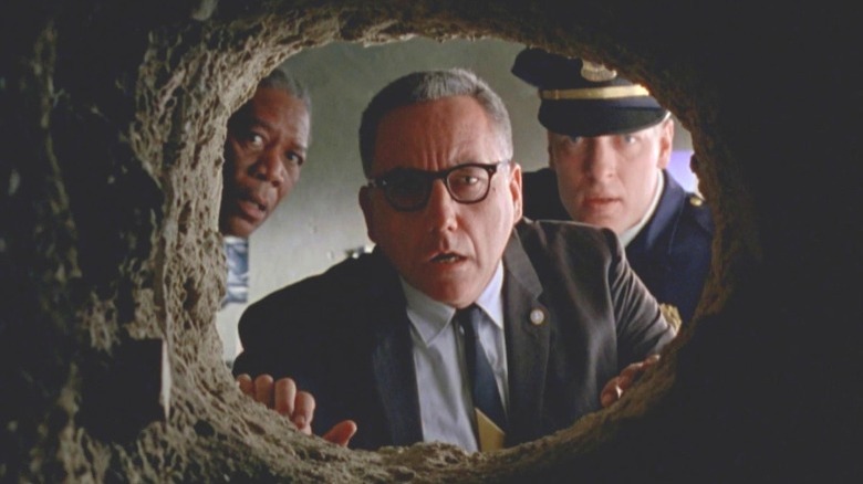 Warden, Hadley, and Red looking at tunnel