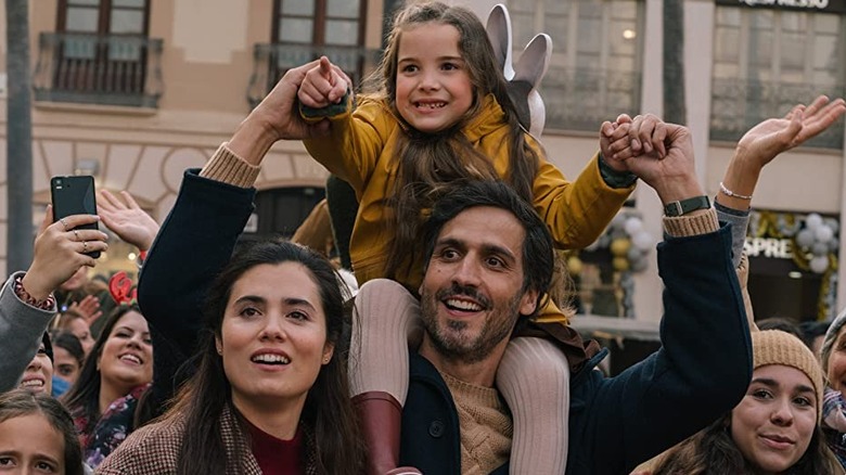 Ana and Alvaro carry a young Amaya