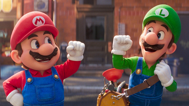 Mario and Luigi fist-bumping