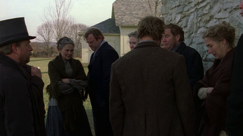 The elders outside a house