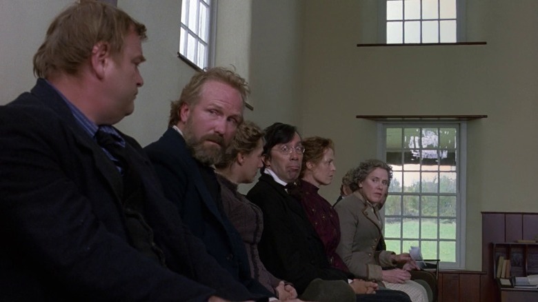 elders sitting in meeting hall