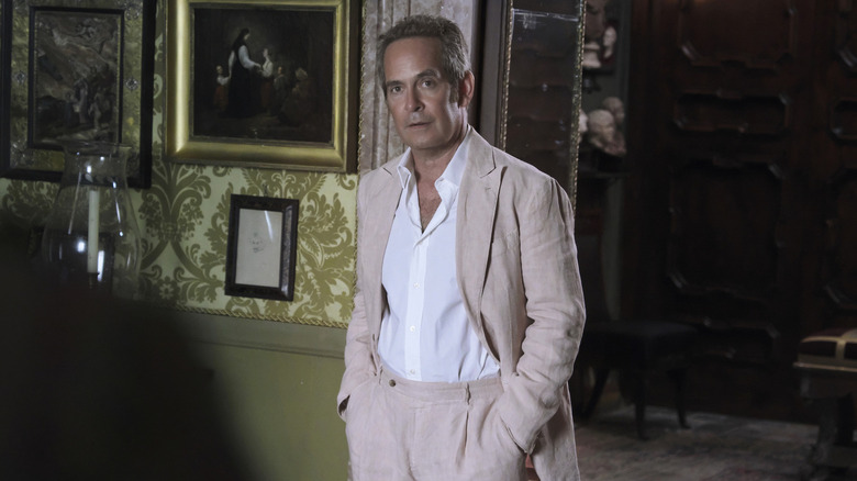 Tom Hollander stands in "The White Lotus"