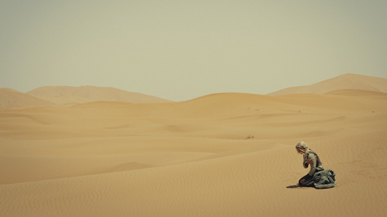 Ciri sitting in the Korath desert