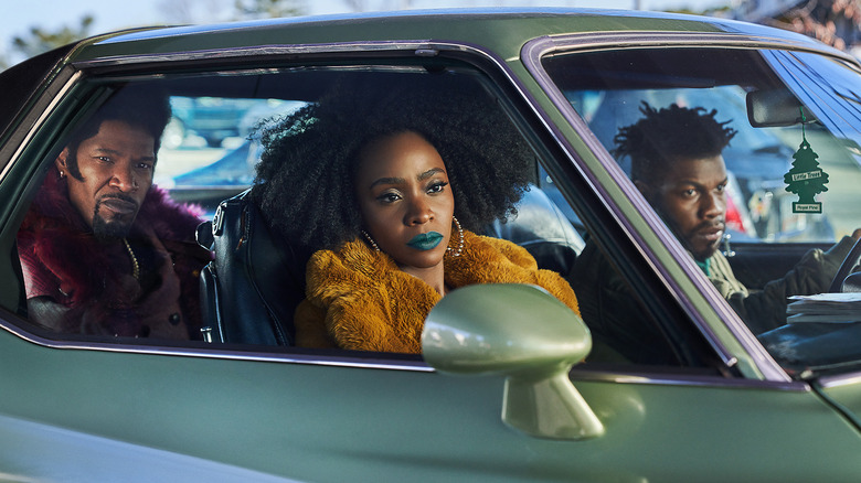 Slick Charles, Yo-Yo, and Tyrone sitting in car