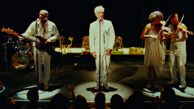 David Byrne performing "This Must Be the Place"