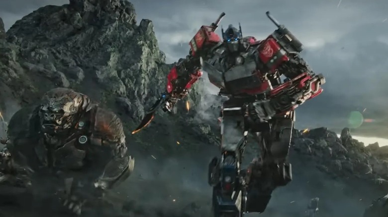 Optimus Prime and Optimus Primal charging into battle