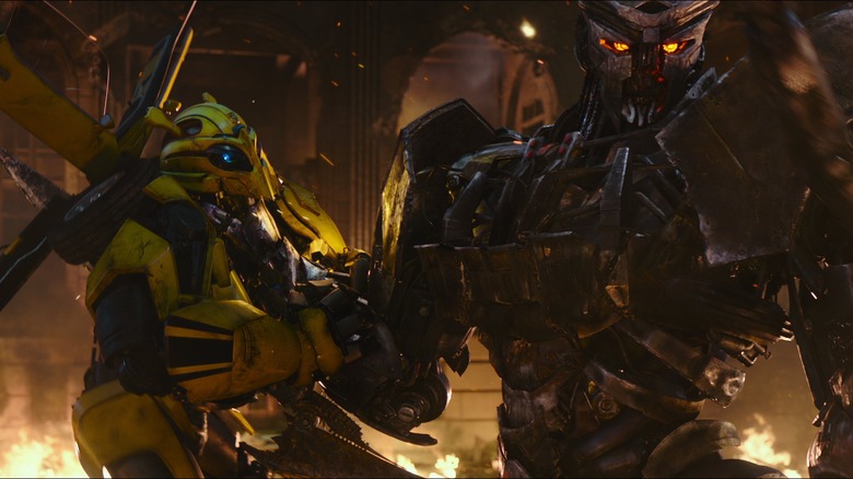 Bumblebee being held up by Scourge