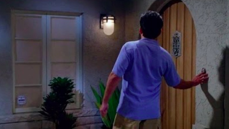 Charlie ringing doorbell of his Malibu beach house