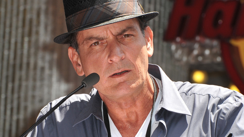 Charlie Sheen posing at film premiere