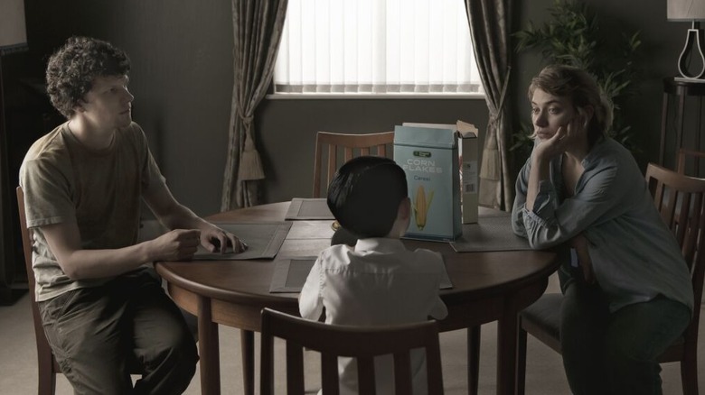 Tom and Gemma sit with the boy at the table