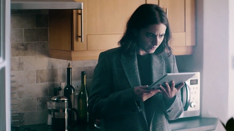 War of the Worlds' Zoe reading ipad in kitchen