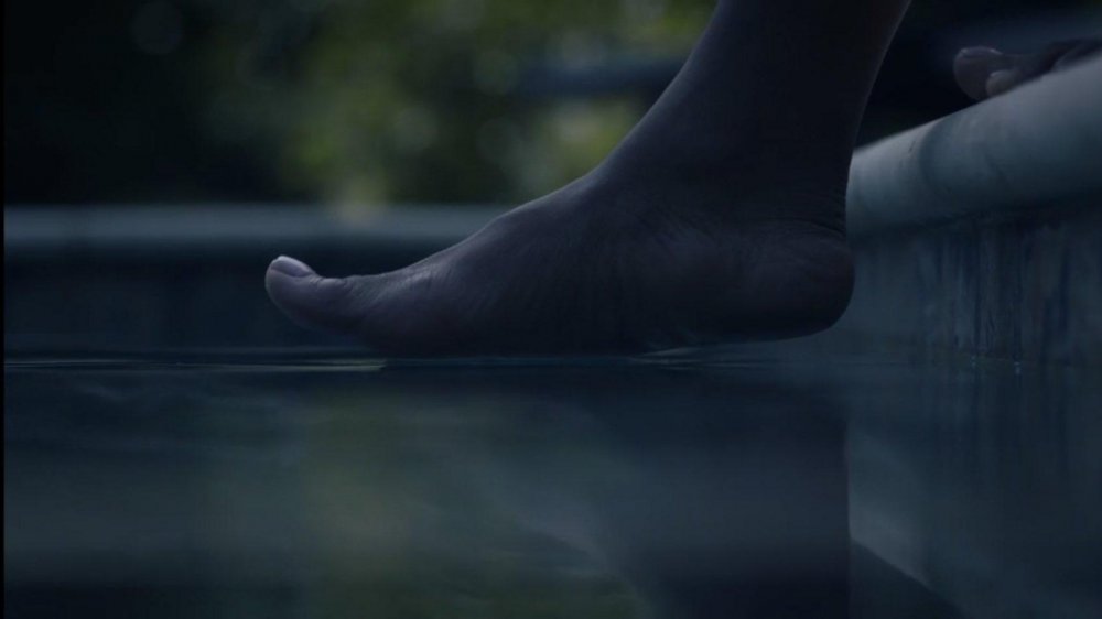 Angela's foot over the water