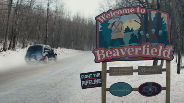 Beaverfield's town sign with logos