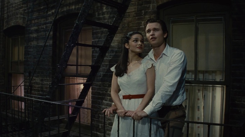 Tony and Maria singing together on a fire escape