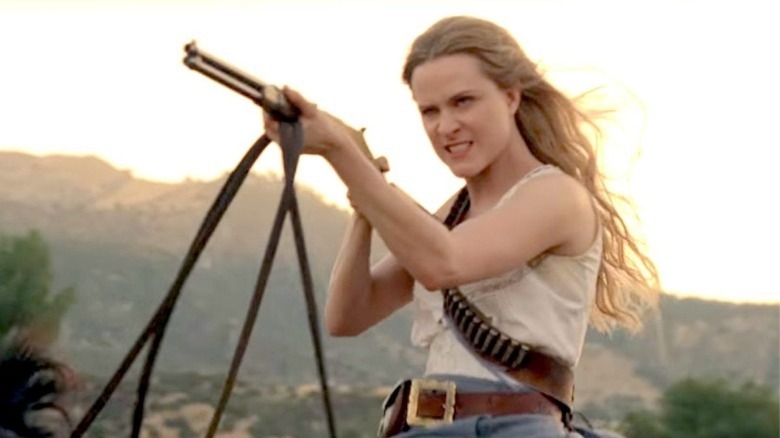 Dolores aiming gun