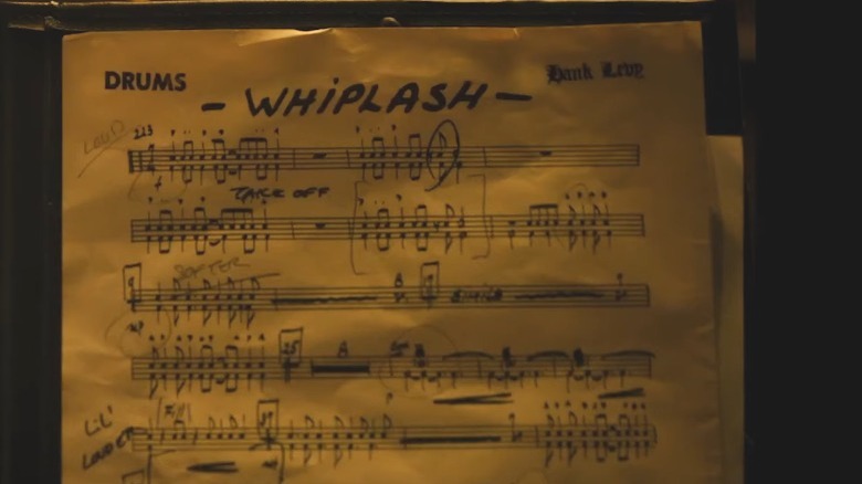 Sheet music reading "DRUMS" and "WHIPLASH"