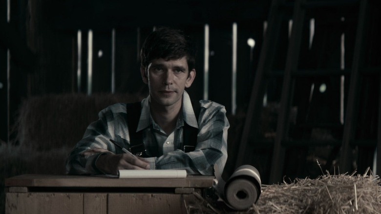 August sitting in the barn