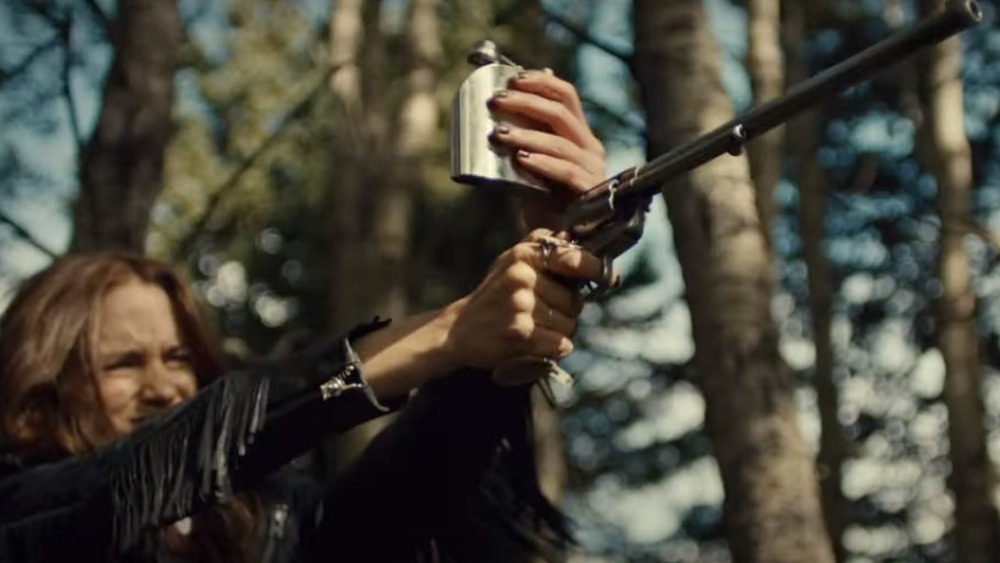 Wynonna with flask and gun