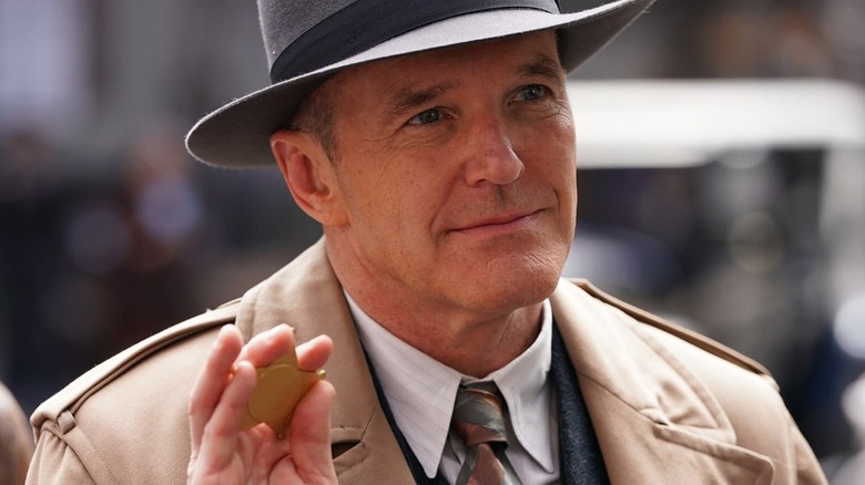 Agent Phillip Coulson displaying badge